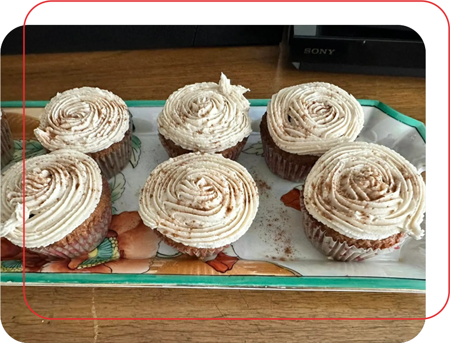 A tray of cupcakes with frosting on top.