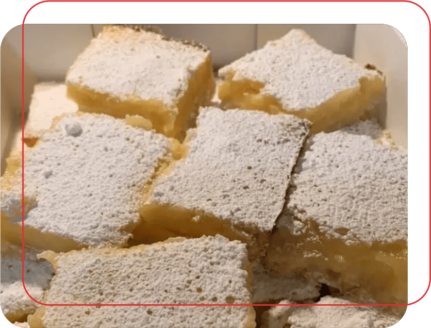 A close up of some white squares of cake