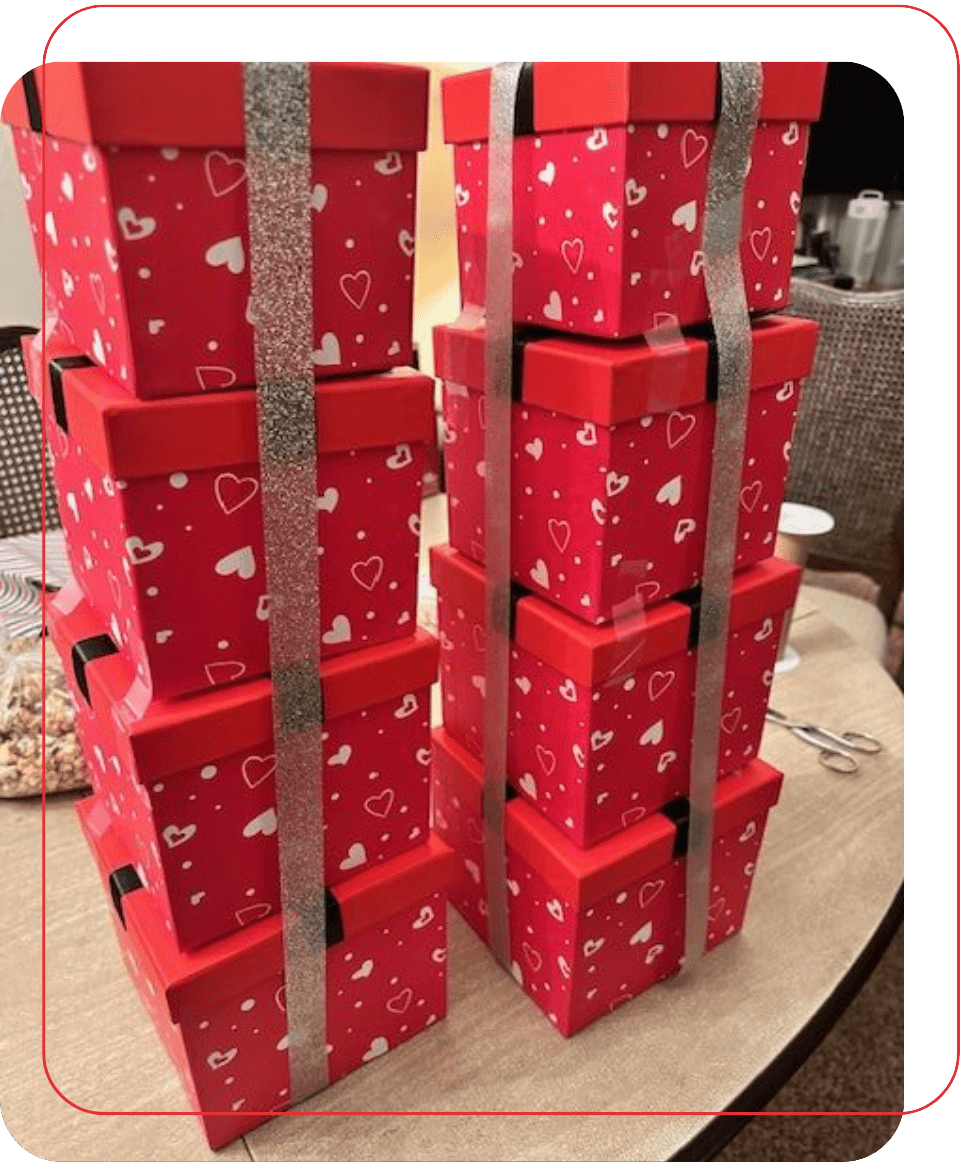 A stack of red boxes with hearts on them.