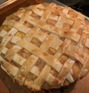 A pie with some type of crust on it