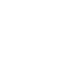 A white cupcake with chocolate chips on top.