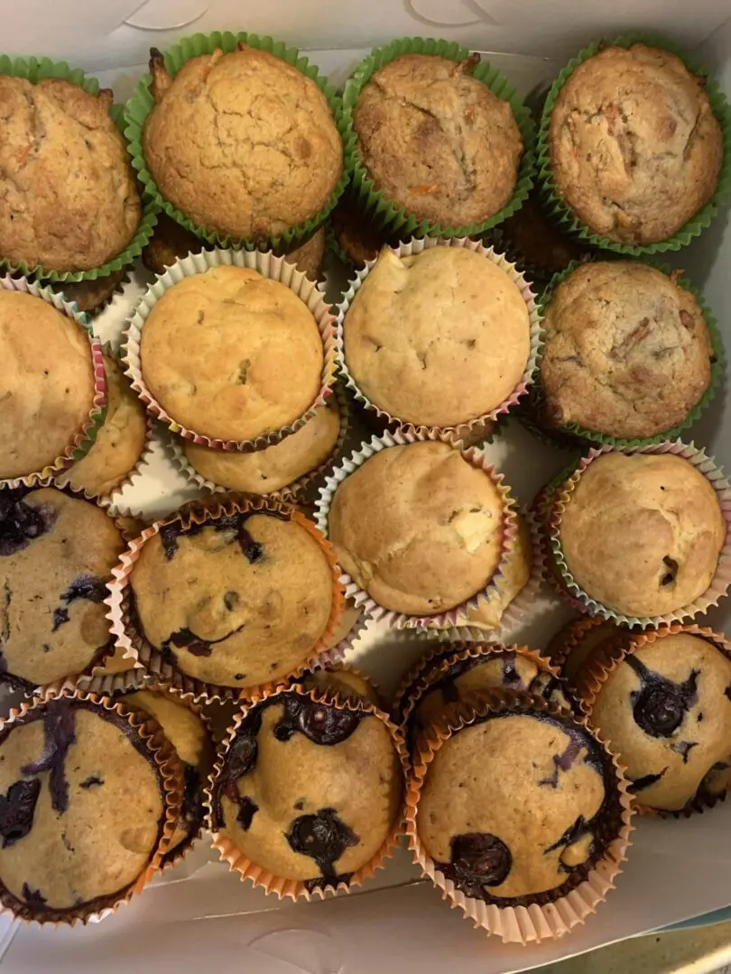 A close up of several muffins in muffin tin.