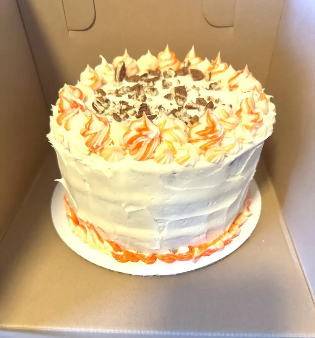 A cake sitting on top of a cardboard box.