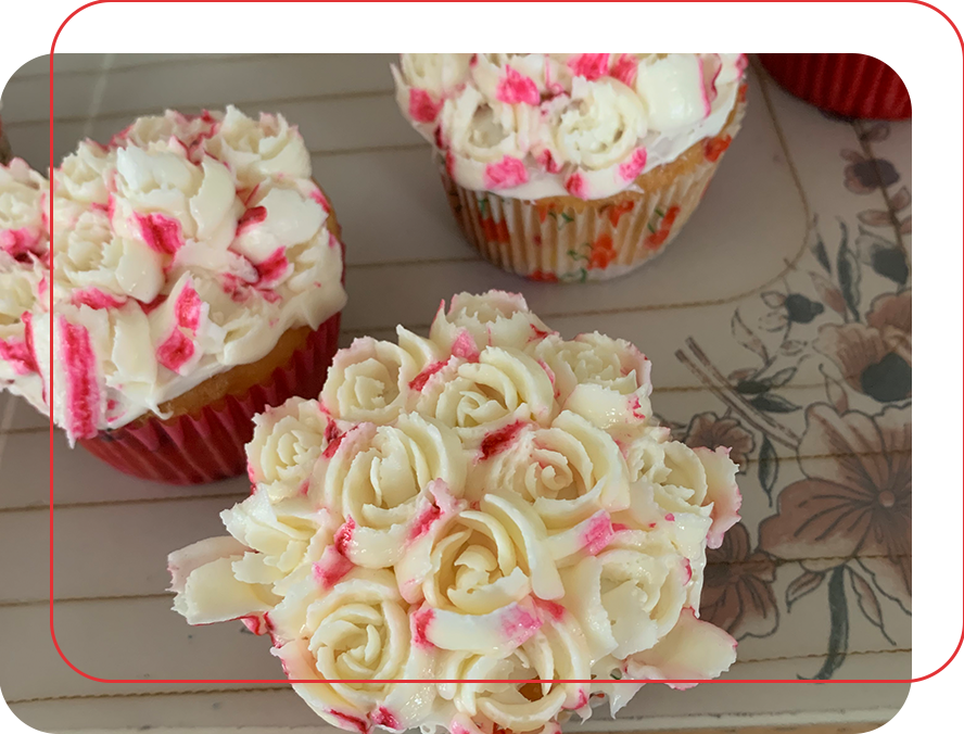 A close up of cupcakes with white frosting