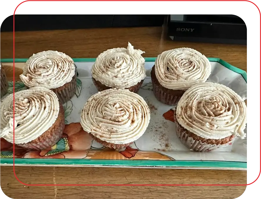 A tray of cupcakes with frosting on top.